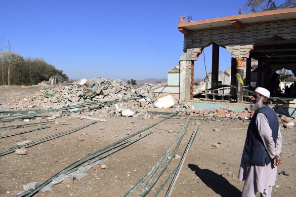 A local resident looks a damaged portion of a mosque near the site of Tuesday's suicide bombing, in Bannu, in northwestern Pakistan, Wednesday, March 5, 2025. (AP Photo/Ijaz Muhammad)