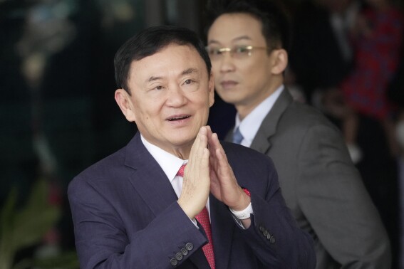 FILE - Thailand's former Prime Minister Thaksin Shinawatra, arrives at Don Muang airport in Bangkok, Thailand, Tuesday, Aug. 22, 2023. Thai prosecutors on Wednesday, May 29, 2024, said Thaksin will be indicted for defaming the monarchy, three months after he was freed on parole on other charges. (AP Photo/Sakchai Lalit, File)