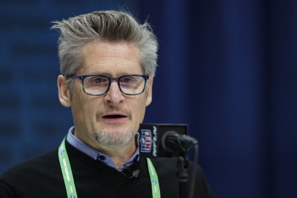 FILE - In this Feb. 25, 2020, file photo, Atlanta Falcons general manager Thomas Dimitroff speaks during a press conference at the NFL football scouting combine in Indianapolis. Dimitroff will be operating his 13th NFL draft as the Atlanta Falcons' general manager from the solitude of his home, following the mandate placed on each team by commissioner Roger Goodell. Dimitroff has made a trade in each of his 12 previous drafts. Don't bet against the trade-happy GM extending that streak this year. (AP Photo/Michael Conroy, File)