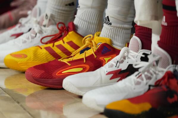 FILE - Basketball sneakers are seen at a game, Tuesday, March 29, 2022, in Chicago. Buy now, pay later loans allow users to pay for items such as new sneakers, electronics or luxury goods in installments. (AP Photo/Charles Rex Arbogast, File)