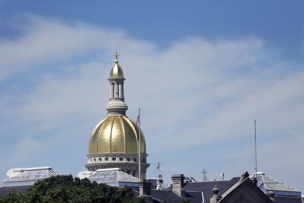 FILE - The Capital dome is seen at the New Jersey Statehouse, June 30, 2016, in Trenton, N.J. New Jersey Republicans are seizing on recent state attorney general lawsuits against school districts aimed at stopping them from outing transgender students' to their parents and stoking skepticism toward offshore wind turbines as issues in this year's election. (AP Photo/Mel Evans, File)