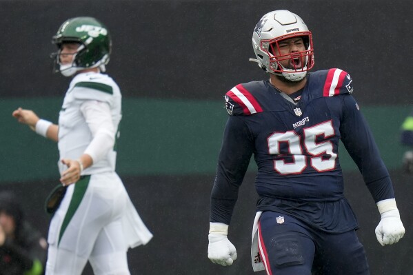 New England Patriots defensive tackle Daniel Ekuale (95) reacts after a play against the New York Jets during the first quarter of an NFL football game, Sunday, Sept. 24, 2023, in East Rutherford, N.J. (AP Photo/Seth Wenig)