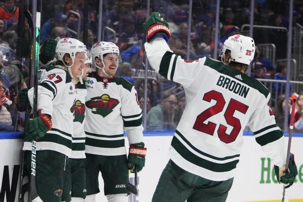 Minnesota Wild's Sam Steel, second from right, celebrates with teammates after scoring a goal against the New York Islanders during the third period of an NHL hockey game Thursday, Jan. 12, 2023, in Elmont, N.Y. The Wild won 3-1. (AP Photo/Frank Franklin II)