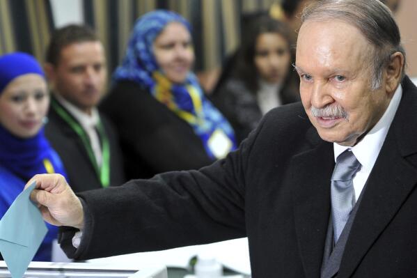 FILE -In this Thursday, Nov. 29, 2012, file photo, Algerian President Abdelaziz Bouteflika casts his ballot for local elections in Algiers. Former Algerian President Bouteflika, who fought for independence from France in the 1950s and 1960s and was ousted amid pro-democracy protests in 2019 after 20 years in power, has died at age 84, state television announced Friday, Sept. 17, 2021. (AP Photo/Anis Belghoul, File)