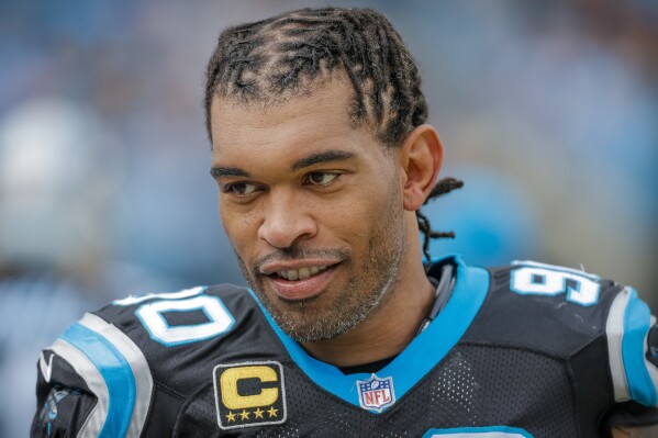 FILE - Carolina Panthers' Julius Peppers looks on from the sidelines during the first half of an NFL football game against the Tampa Bay Buccaneers in Charlotte, N.C., Dec. 24, 2017. Three-time All-Pros Julius Peppers and Antonio Gates were chosen as semifinalists for the Pro Football Hall of Fame’s class of 2024 in their first year of eligibility. Peppers and Gates headline a group of 25 modern day semifinalists announced Tuesday, Nov. 28, 2023, by the Hall of Fame from a group of 173 nominees announced in September. (AP Photo/Bob Leverone, File)