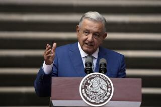FILE - Mexican President Andres Manuel Lopez Obrador speaks during the North America Summit, at the National Palace in Mexico City, Jan. 10, 2023. Obrador said on Feb. 23, 2023 that he'll sign a new bill into law that will cut funding to the country’s electoral agency. (AP Photo/Fernando Llano, File)