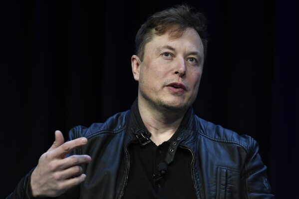 FILE - Tesla and SpaceX CEO Elon Musk speaks at the SATELLITE Conference and Exhibition, March 9, 2020, in Washington. On Monday, July 15, 2024, Musk appeared to confirm a report that the company's much-ballyhooed event to unveil a robotaxi will be delayed beyond its scheduled Aug. 8 date. (AP Photo/Susan Walsh, File)