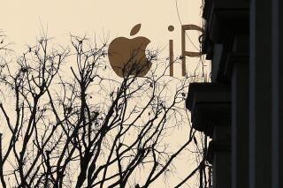 FILE - A huge publicity billboard is seen in downtown Milan, Italy, on Dec. 30, 2015. Italy’s anti-trust authority has opened an investigation into allegations that Apple is abusing its dominant position in the app market, officials said Thursday, May 11, 2023. (AP Photo/Antonio Calanni)