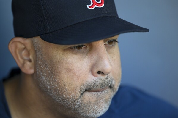 Boston Red Sox manager Alex Cora talks to the media before a baseball game against the Kansas City Royals, Saturday, Sept. 2, 2023, in Kansas City, Mo. (AP Photo/Reed Hoffmann)