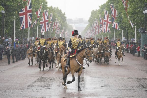 Members of the military ride along The Mall during the return of the royal procession to Buckingham Palace following the Trooping the Color, London, Saturday, June 15, 2024. Trooping the Color is the King's Birthday Parade and one of the nation's most impressive and iconic annual events attended by almost every member of the Royal Family. (Jonathan Brady/PA via AP)