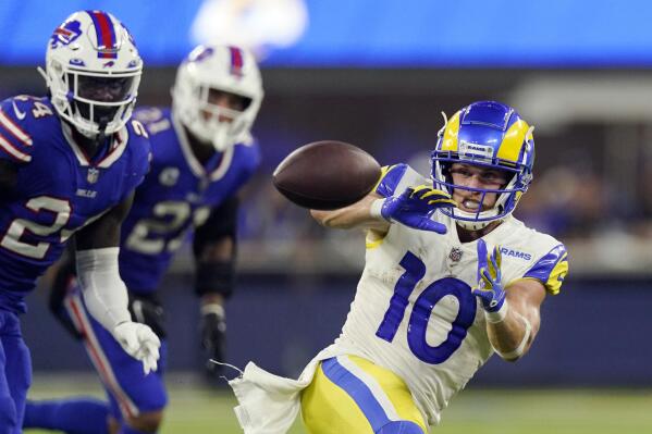 Los Angeles Rams wide receiver Cooper Kupp (10) makes a catch in front of Buffalo Bills cornerback Kaiir Elam, left, during the second half of an NFL football game Thursday, Sept. 8, 2022, in Inglewood, Calif. (AP Photo/Mark J. Terrill)