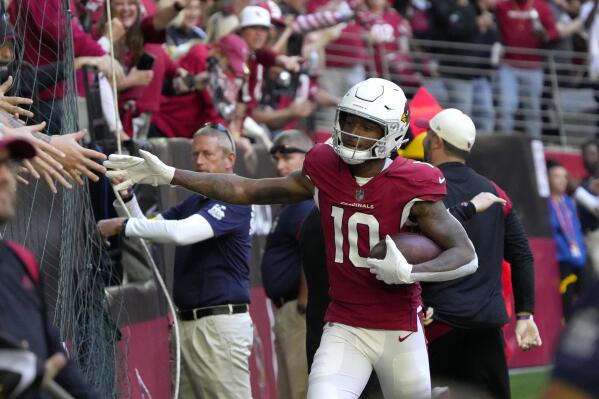 Arizona Cardinals wide receiver DeAndre Hopkins (10) celebrates his touchdown with fans during the first half of an NFL football game against the Los Angeles Chargers, Sunday, Nov. 27, 2022, in Glendale, Ariz. (AP Photo/Rick Scuteri)