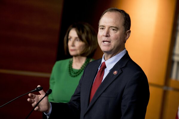 Rep. Adam Schiff, D-Calif., Chairman of the House Intelligence Committee, right, accompanied by House Speaker Nancy Pelosi of Calif., left, speaks about the House impeachment inquiry into President Donald Trump at a news conference on Capitol Hill in Washington, Tuesday, Oct. 15, 2019. (AP Photo/Andrew Harnik)