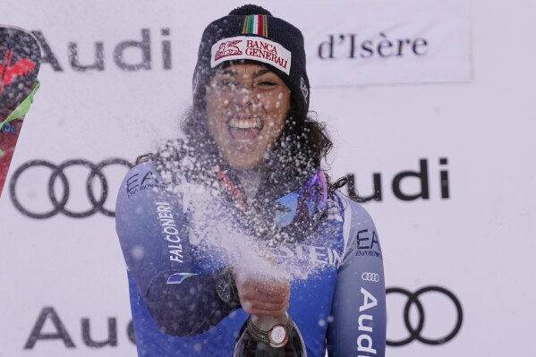 The winner Italy's Federica Brignone celebrates after an alpine ski, women's World Cup Super G race, in Val d'Isere, France, Sunday, Dec. 17, 2023. (AP Photo/Giovanni Auletta)