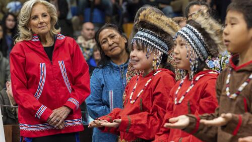 U.S. first lady Jill Biden, left, and first lady of Alaska Rose Dunleavy watch a performance by Ayaprun Elitnaurvik students during an event at Bethel Regional High School in Bethel, Alaska on Wednesday, May 17, 2023. Ayaprun Elitnaurvik is a Yugtun immersion school in Bethel. Biden and Interior Secretary Deb Haaland traveled to Bethel to highlight the Biden-Harris administration's investments to expand broadband internet connectivity in Native American communities, including Alaska's Yukon-Kuskokwim Delta. (Loren Holmes/Anchorage Daily News via AP)