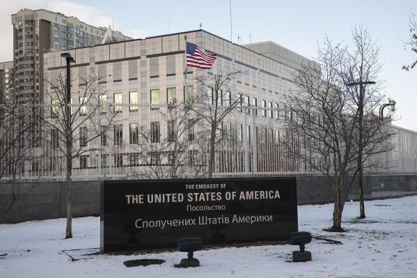 A view of the U.S. Embassy in Kyiv, Ukraine, Saturday, Feb. 12, 2022. U.S. officials told The Associated Press that the State Department plans to announce Saturday that virtually all American staff at the Kyiv embassy will be required to leave. The State Department would not comment. The department had earlier ordered families of U.S. embassy staffers in Kyiv to leave. But it had left it to the discretion of nonessential personnel if they wanted to depart. (AP Photo/Andrew Kravchenko)