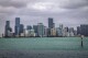 The Miami skyline is viewed from the Rickenbacker Causeway in South Florida, Dec. 15, 2023. South Carolina and Florida were the two fastest-growing states in the U.S., as the South region dominated population gains in 2023, and the U.S. growth rate ticked upward slightly from the depths of the pandemic due to a drop in deaths, according to estimates released Tuesday, Dec. 19 by the U.S. Census Bureau. (Pedro Portal/Miami Herald via AP)