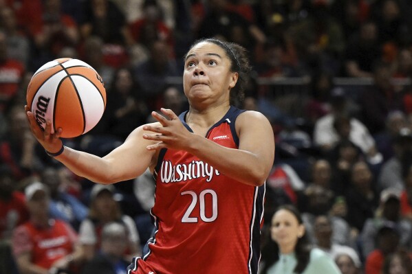 FILE - Washington Mystics guard Kristi Toliver (20) goes to the basket for a lay up during the second half of a WNBA basketball game against the New York Liberty, Friday, May 19, 2023, in Washington. The Phoenix Mercury have hired three-time WNBA All-Star and former NBA assistant Kristi Toliver as associate head coach. Toliver will join the staff of first-year coach Nate Tibbetts in the hiring announced on Friday, Dec. 1, 2023.(APPhoto/Terrance Williams, File)