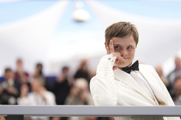 David Vodstrcil poses for photographers in the photo Call for the Film 'Caravan' at the 78th International Film Festival, Cannes, southern France, Thursday, May 22, 2025.