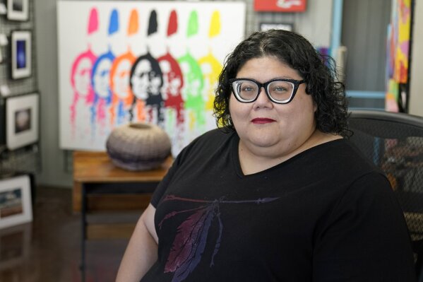 Frances Danger poses for a photo in her family's art gallery, Carpe Artem, Tuesday, Aug. 25, 2020, in Oklahoma City. Danger joined the campaign to pressure Washington's NFL team to drop its offensive name several years ago after her daughter was the target of racist slurs. (AP Photo/Sue Ogrocki)