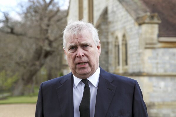 Britain's Prince Andrew during a television interview at the Royal Chapel of All Saints at Royal Lodge, Windsor, following the announcement of Prince Philip, in England, Sunday, April 11, 2021. Britain's Prince Philip, the irascible and tough-minded husband of Queen Elizabeth II who spent more than seven decades supporting his wife in a role that mostly defined his life, died on Friday. (Steve Parsons/Pool Photo via AP)