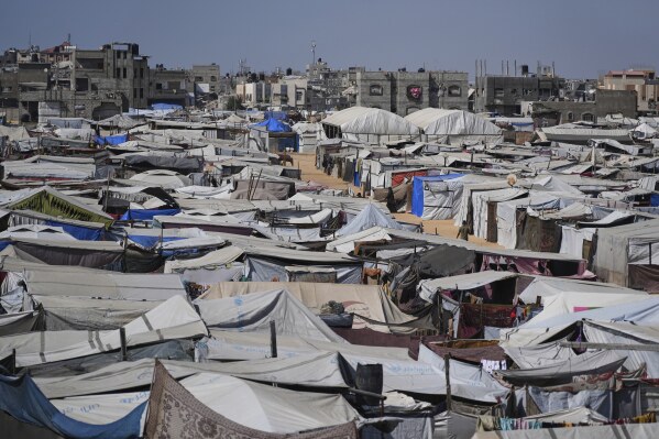 A makeshift tent camp for displaced Palestinians is seen in Khan Younis, Gaza, Friday, June 6, 2025. (AP Photo/Abdel Kareem Hana)