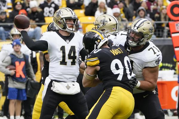 New Orleans Saints quarterback Andy Dalton (14) gets off a pass under pressure by Pittsburgh Steelers linebacker T.J. Watt (90) with offensive tackle Ryan Ramczyk (71) blocking during the first half of an NFL football game in Pittsburgh, Sunday, Nov. 13, 2022. (AP Photo/Keith Srakocic)