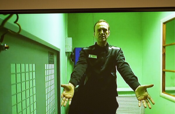 FILE - Russian opposition leader Alexei Navalny is seen via a video link to a courtroom in Moscow on Oct. 18, 2022. Voters are heading to the polls in Russia for a three-day presidential election that is all but certain to extend President Vladimir Putin's rule after he clamped down on dissent. His political opponents are either in jail or in exile abroad, and Navalny, the fiercest of them, died in a remote Arctic penal colony recently. (AP Photo, File)