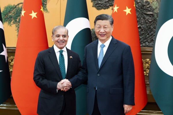 In this photo released by Xinhua News Agency, Chinese President Xi Jinping meets with Pakistani Prime Minister Shehbaz Sharif at the Great Hall of the People in Beijing, Friday, June 7, 2024. Beijing is willing to work with Islamabad to build an upgraded version of an economic corridor linking the two countries, China's leader Xi Jinping told the visiting Pakistani Prime Minister Shehbaz Sharif Friday.(Huang Jingwen/Xinhua via AP)