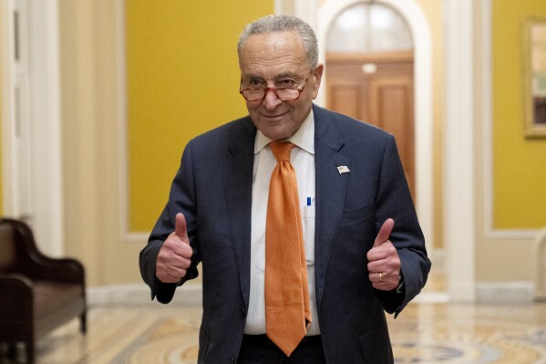 Senate Majority Leader Chuck Schumer, D-N.Y., gives two thumbs up as the Senate votes to approve a 45-day funding bill to keep federal agencies open, Saturday, Sept. 30, 2023, in Washington. (AP Photo/Andrew Harnik)