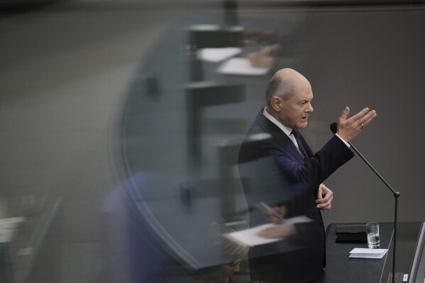 German Chancellor Olaf Scholz answers questions from lawmakers at the German parliament Bundestag in Berlin, Wednesday, March 13, 2024. (AP Photo/Markus Schreiber)