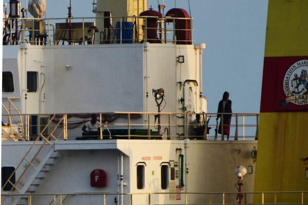 This photograph shared by Indian navy on the X platform shows people on board the hijacked ship ex-MV Ruen, Saturday, March 16, 2024. Indian navy says that it has intercepted the ship and has demanded that the pirates surrender and release all civilians held hostage on the ship. (Indian Navy on X via AP)