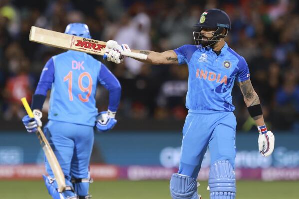 India's Virat Kohli gestures with his bat after scoring 50 runs during the T20 World Cup cricket match between India and Bangladesh in Adelaide, Australia, Wednesday, Nov. 2, 2022. (AP Photo/James Elsby)