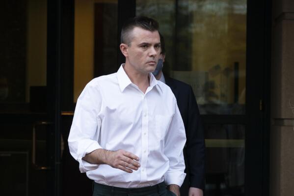 FILE - Igor Danchenko leaves the Albert V. Bryan United States Courthouse in Alexandria, Va., Nov. 4, 2021. Danchenko, a think tank analyst who played a major role in the creation of a flawed report about former President Donald Trump, is scheduled to go on trial Tuesday, Oct. 11, 2022, for lying to the FBI about how he developed information that went into what is now infamously known as the “Steele dossier.” (AP Photo/Manuel Balce Ceneta, File)