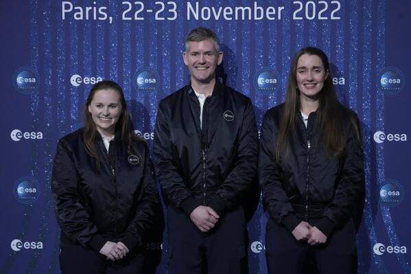 ESA's new parastronaut John McFall, a British former Paralympic sprinter who will take part in a potentially groundbreaking feasibility study to explore whether physical disability will impair space travel, poses with ESA's new astronauts Meganne Christian, left, and Rosemary Coogan, right, during the ESA Council at Ministerial level (CM22) at the Grand Palais Ephemere, in Paris, Wednesday, Nov. 23, 2022. The European Space Agency has selected a disabled former athlete to be among its its newest astronaut recruits as part of its first recruitment drive in over a decade that aimed to bring diversity to space travel. (AP Photo/Francois Mori)