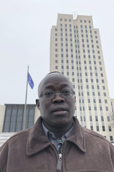 Reuben Panchol is shown Friday, Dec. 6, 2019 at the North Dakota state capitol in Bismarck. Panchol, who immigrated from Sudan to North Dakota as a child, says he hopes to tell his personal story at a meeting Monday, Dec. 9 at which the Burleigh County Commission may vote against accepting any new refugees. It's believed the county would be the first to do so since President Donald Trump's executive order earlier this fall gave states and counties the ability to do so. (AP Photo/James MacPherson)