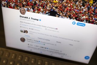 President Donald Trump's Twitter feed is photographed on an Apple iPad in New York, Thursday, June 27, 2019. Trump’s next tweet might come with a warning label. Starting Thursday tweets that Twitter deems in the public interest, but which violate the service’s rules, will be obscured by a warning explaining the violation. Users will have to tap through the warning to see the underlying message. (AP Photo/J. David Ake)