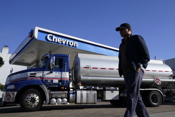 FILE - A man walks past a tanker at a Chevron gas station in San Francisco, Oct. 23, 2023. On Thursday, April 11, 2024, the Labor Department releases producer prices data for March. (AP Photo/Jeff Chiu, File)