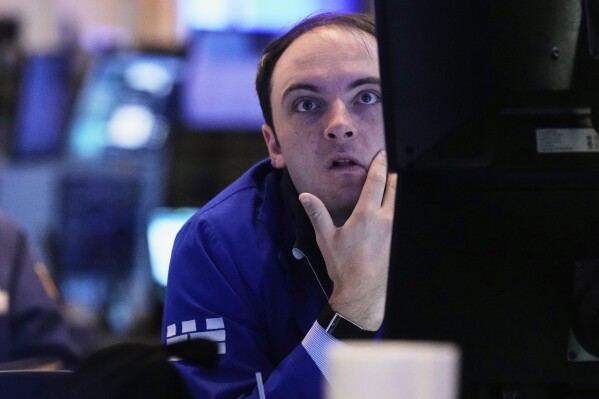 Specialist Joseph Maguire works at his post on the floor of the New York Stock Exchange, Tuesday, May 20, 2025. (AP Photo/Richard Drew)