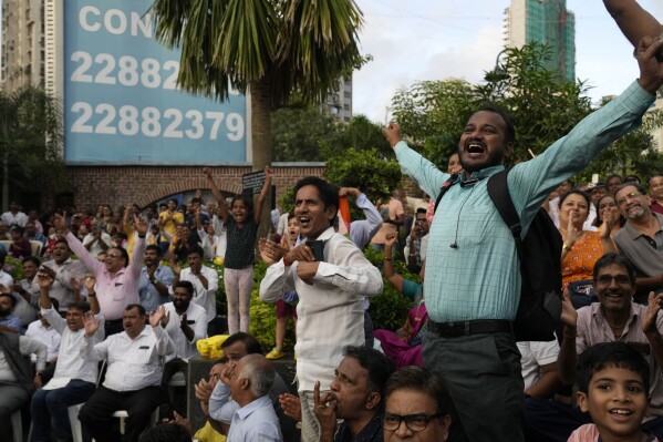 People celebrate as they watch a live telecast of the landing og Chandrayaan-3, or “moon craft” in Sanskrit, in Mumbai, India, Wednesday, Aug. 23, 2023. (AP Photo/Rajanish Kakade)
