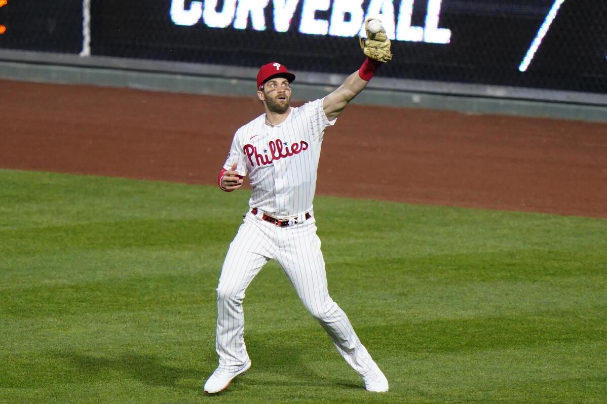 Harper, Segura return for Phillies to start against Braves AP News