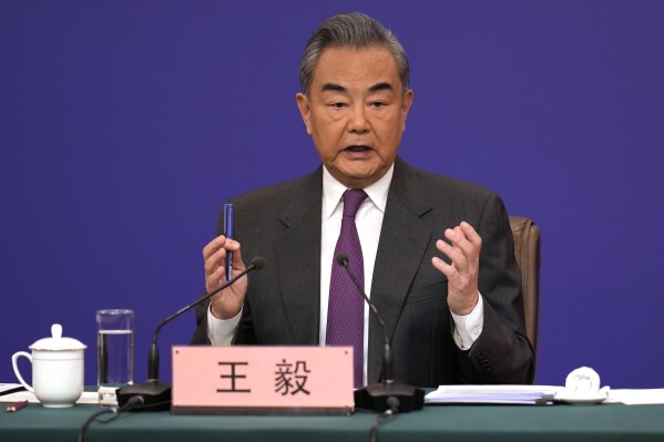 Chinese Foreign Minister Wang Yi speaks during a press conference on the sideline of the National People's Congress in Beijing, Thursday, March 7, 2024. (AP Photo/Ng Han Guan)