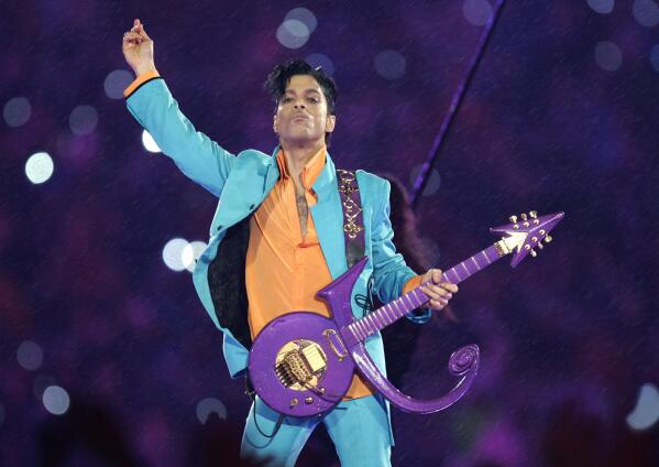 FILE - Prince performs during the halftime show at the Super Bowl XLI football game in Miami, Feb. 4, 2007. The late pop superstar Prince will have a highway named after him, thanks to Minnesota lawmakers who voted Thursday, May 4, 2023, to dedicate the highway that runs past his Paisley Park museum and studios to the creator of hits including "Little Red Corvette," Let’s Go Crazy" and "When Doves Cry." (AP Photo/Chris O'Meara, File)