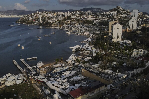 Damage is seen at a yacht club in the aftermath of Hurricane Otis in Acapulco, Mexico, Saturday, Oct. 28, 2023. (AP Photo/Felix Marquez)