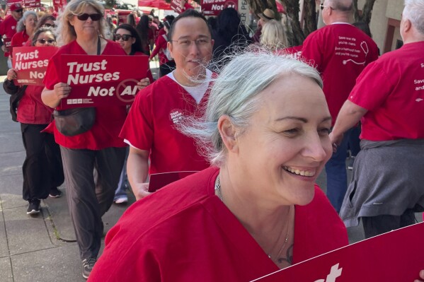 Nurses hold a rally in San Francisco to highlight safety concerns regarding the use of artificial intelligence in health care.