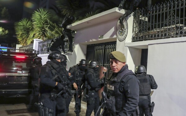 Police storm the Mexican embassy in Quito, Ecuador, Friday, April 5, 2024. The action came hours after the Mexican government granted political asylum to former Vice President of Ecuador Jorge Glass.  (AP Photo/David Bustillos)