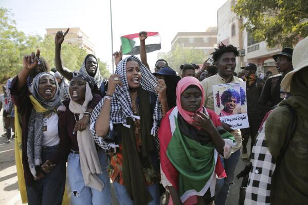 Sudanese demonstrators march in Khartoum, Sudan, Thursday, Dec. 8, 2022 to protest a deal signed between the country’s main pro-democracy group and its ruling generals, who seized power in an October 2021 coup. The framework deal, signed on Monday, Dec. 5, 2022, is meant to guide the country’s transition until elections but key dissenters have stayed out of the agreement. (AP Photo/Marwan Ali)