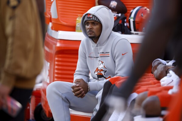 FILE - Cleveland Browns quarterback Deshaun Watson (4) sits on the bench during an NFL football game against the Pittsburgh Steelers, Sunday, Nov. 19, 2023, in Cleveland. For the third straight year, Cleveland is without a first-round pick after shipping three along with a handful of late-round selections to the Houston Texas in 2022 for Watson, who has yet to deliver a championship or even a playoff win. (AP Photo/Kirk Irwin, File)