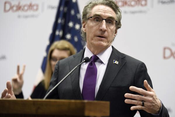 FILE - North Dakota Gov. Doug Burgum speaks at the state Capitol on April 10, 2020, in Bismarck, N.D. Teachers in North Dakota can still refer to transgender students by the personal pronouns they use, after lawmakers on Monday, April 3, 2023, failed to override the governor’s veto of a controversial bill to place restrictions on educators. (Mike McCleary/The Bismarck Tribune via AP, File)