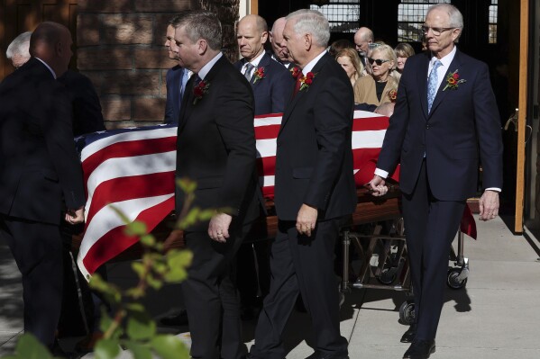 The casket is carried during the funeral for President M. Russell Ballard of The Church of Jesus Christ of Latter-day Saints at the Tabernacle in Salt Lake City, Friday, Nov. 17, 2023. Associates and children of a top leader of The Church of Jesus Christ of Latter-day Saints remembered him at the funeral as a principled and compassionate man and exemplar of the faith. Ballard, who died Sunday at age 95, was second-in-line to the church presidency as the second-longest-tenured member of a top governing body called the Quorum of the Twelve Apostles. (Jeffrey D. Allred/The Deseret News via AP)